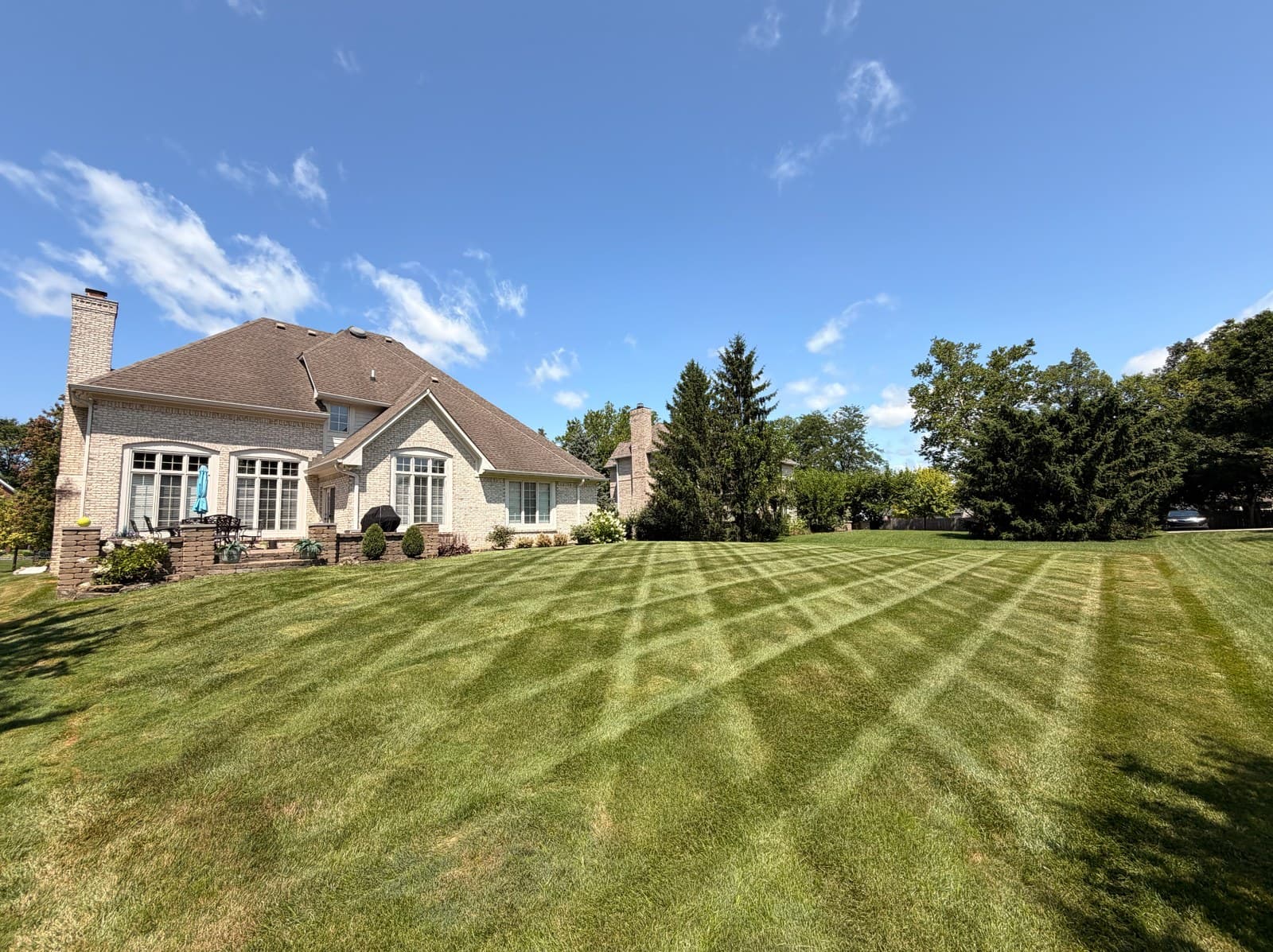 Clean Mowing Stripes on a Large Residential Lawn image