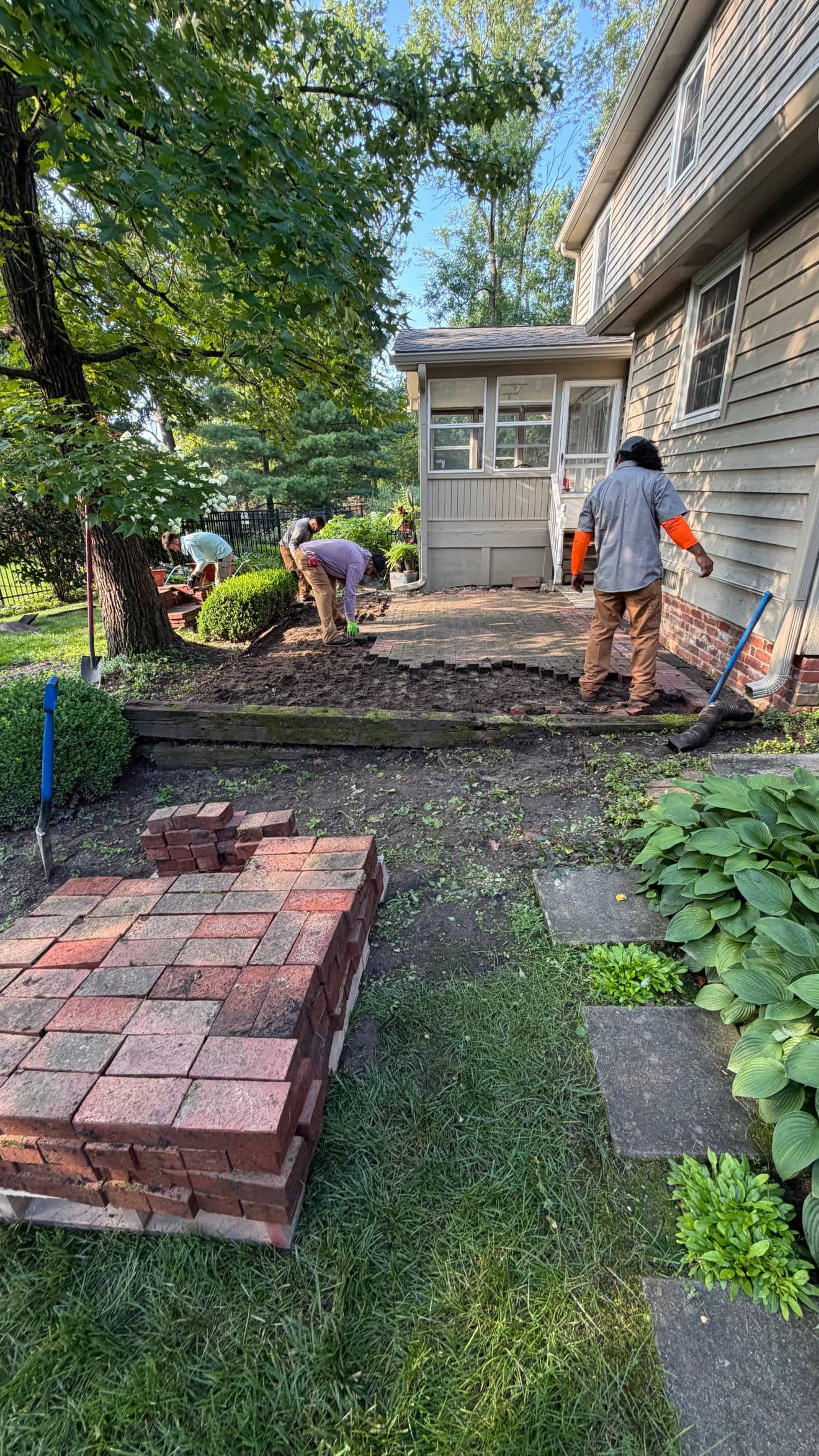 Brick Patio Restoration and Railroad Tie Revamp in Progress image