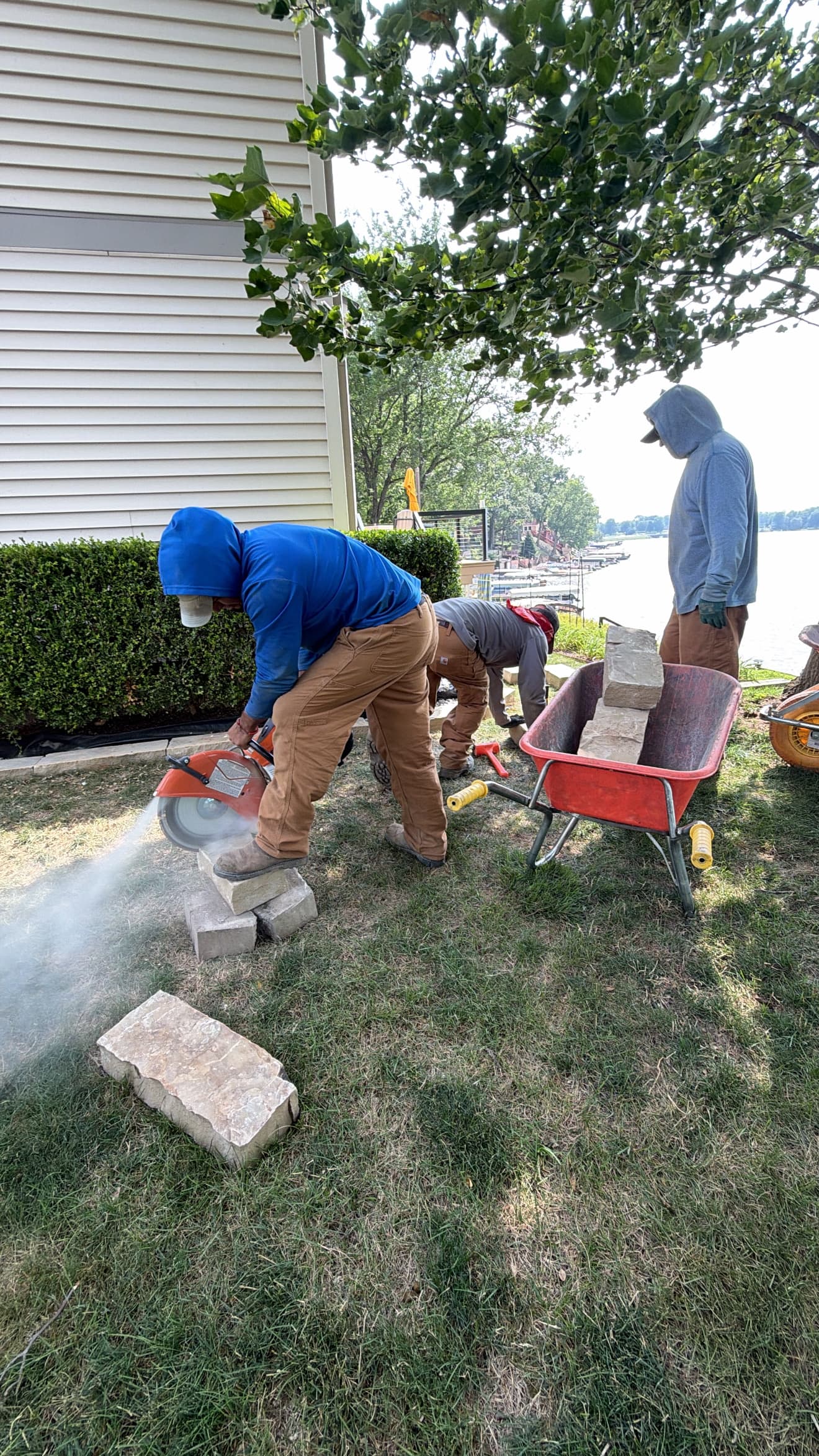 Stone Retaining Wall Being Built Around Landscaping in Cicero Indiana image