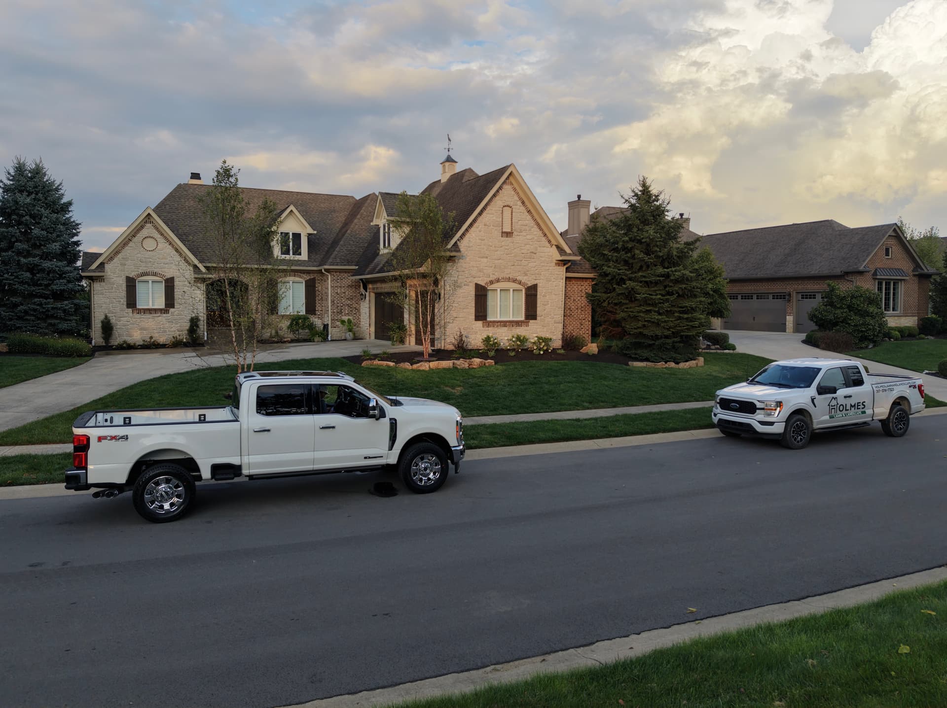 Front Landscape Renovation with Boulder Wall and Birch Trees in Noblesville image