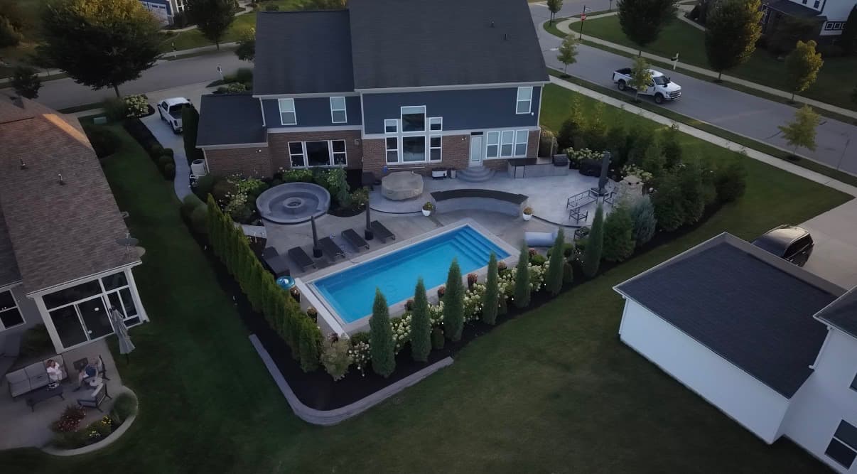 Custom Backyard Build With Outdoor Kitchen and Retaining Wall image